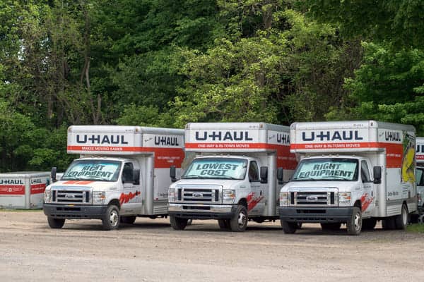 U-Haul trucks in a parking lot available for rent
