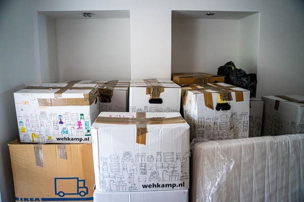 Moving boxes stacked in a room