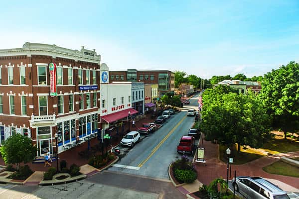 an aerial view of buildings in the main downtown square in Bentonville Arkansas