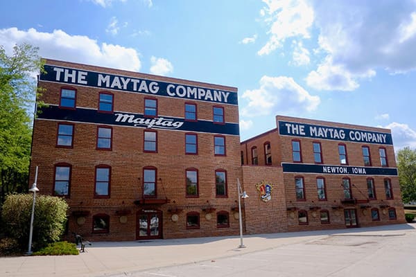 two old Maytag buildings made of brick in downtown Newton Iowa