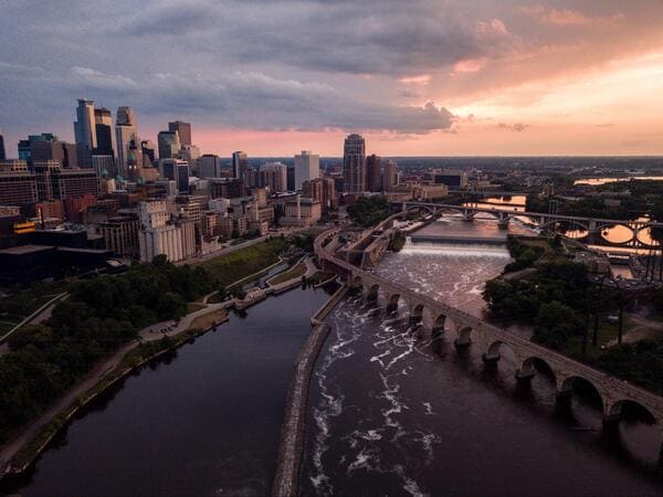 an aerial view of the minneapolis skyline at dusk