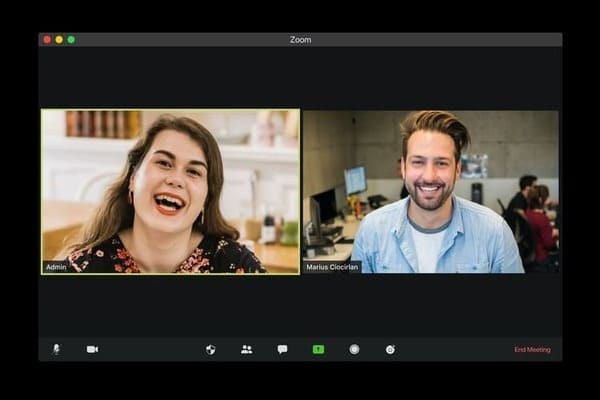 A video meeting with two people talking while remotely working