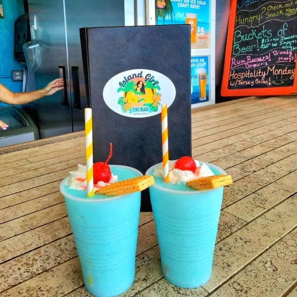 Two frozen drinks sit on the bar at Island Girl Tiki Bar