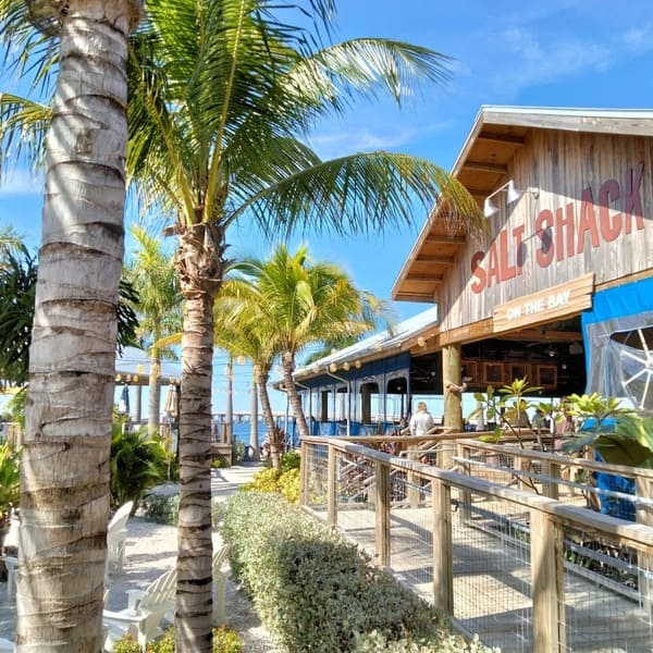An exterior shot of the Salt Shack on the Bay Restaurant on a sunny day