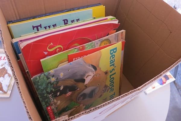 an open box filled with childrens books