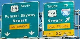 Highway signs showing an alternate route for trucks